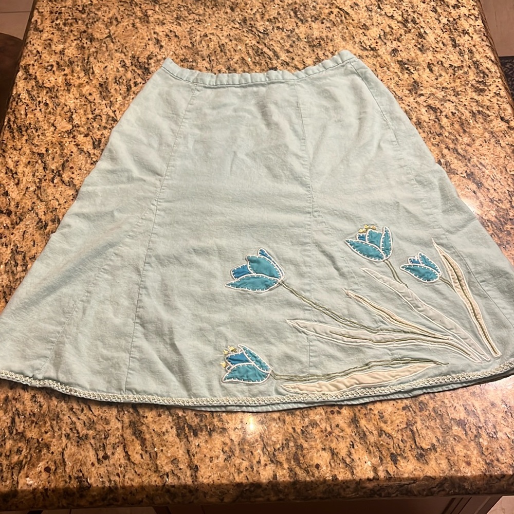 Beautiful teal skirt with tulip detail.
